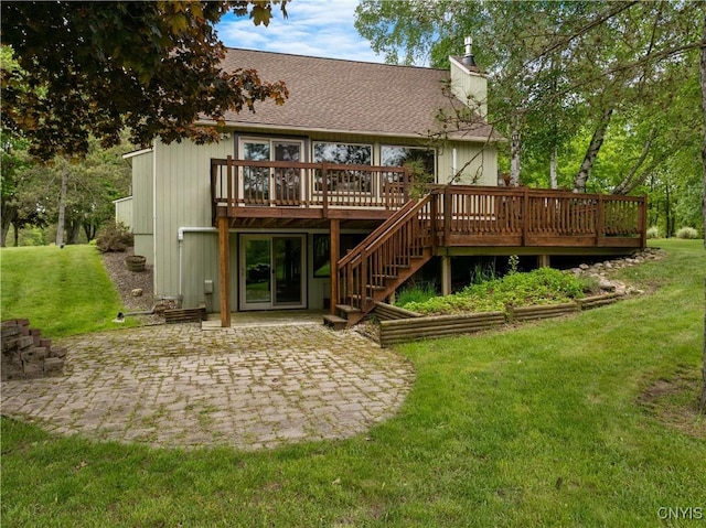 147 Crooked Lake Rd, Tully, NY 13159 - back of house featuring a patio area, a wooden deck, a lawn, a chimney, and roof with shingles