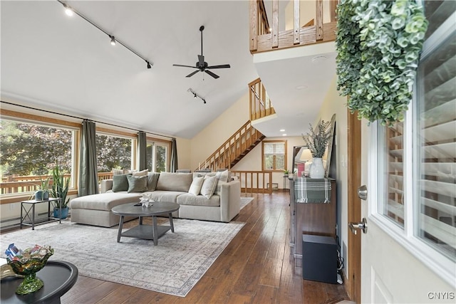 147 Crooked Lake Rd, Tully, NY 13159 - living room featuring rail lighting, stairs, ceiling fan, dark wood-style flooring, and high vaulted ceiling