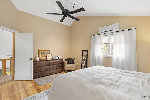 147 Crooked Lake Rd, Tully, NY 13159 - bedroom with a wall mounted AC, lofted ceiling, wood finished floors, and a ceiling fan