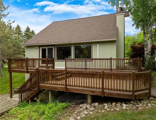 147 Crooked Lake Rd, Tully, NY 13159 - rear view of house with a shingled roof, a chimney, a deck, and stairway
