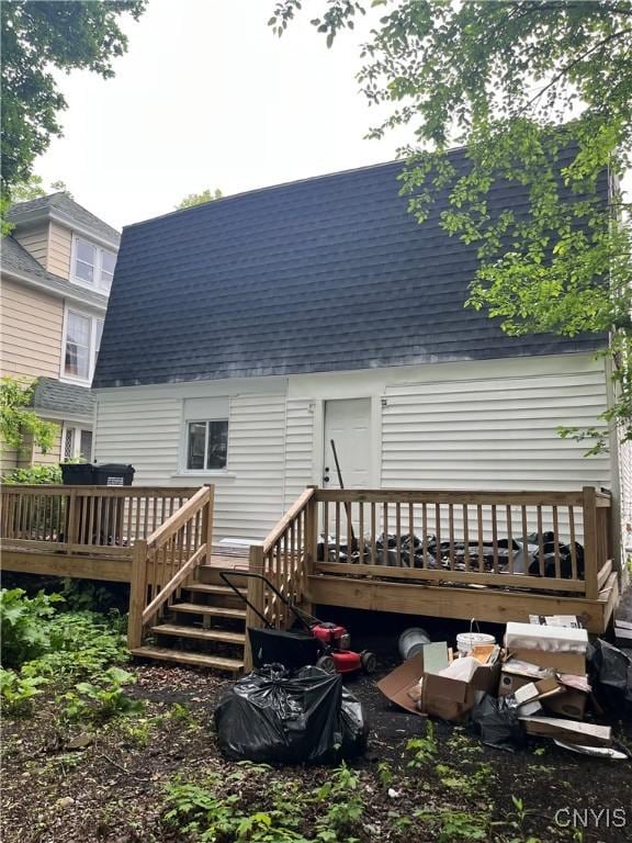 2608 Midland Ave, Syracuse, NY 13205 - back of property featuring roof with shingles and a deck