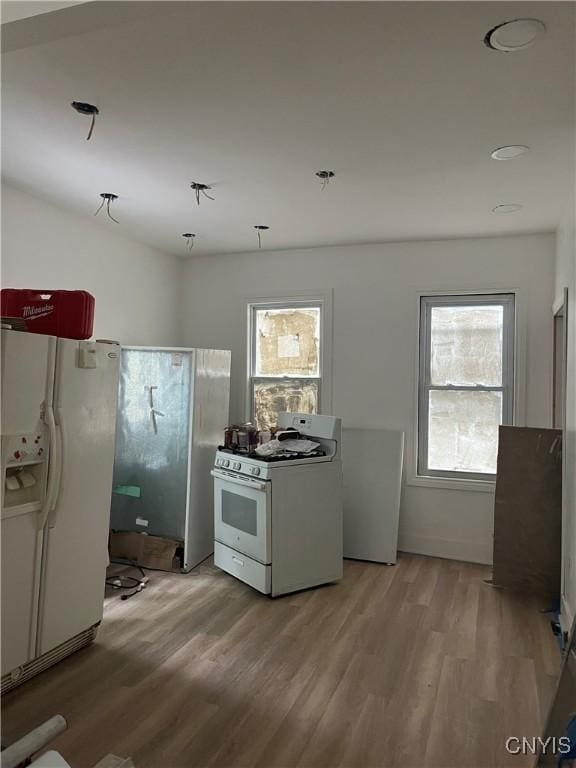 2608 Midland Ave, Syracuse, NY 13205 - kitchen with white appliances and light wood-style floors