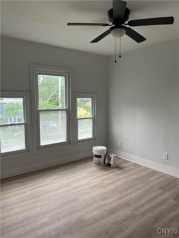 2608 Midland Ave, Syracuse, NY 13205 - unfurnished room featuring wood finished floors, baseboards, and a ceiling fan