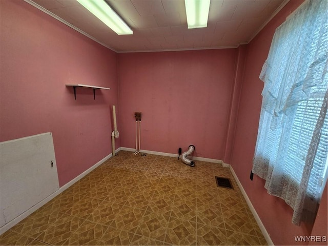4003 Wood Rd, Albion, NY 14411 - laundry room with crown molding, tile patterned floors, and baseboards