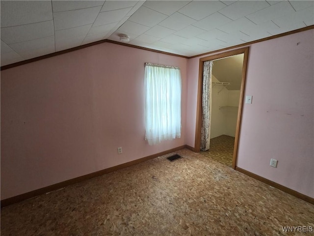 4003 Wood Rd, Albion, NY 14411 - unfurnished bedroom with crown molding, carpet, a closet, baseboards, and vaulted ceiling