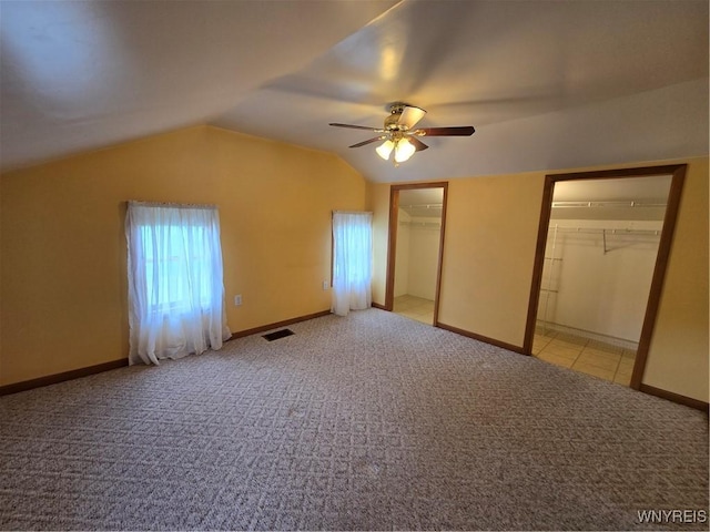 4003 Wood Rd, Albion, NY 14411 - unfurnished bedroom with carpet flooring, lofted ceiling, a ceiling fan, and baseboards
