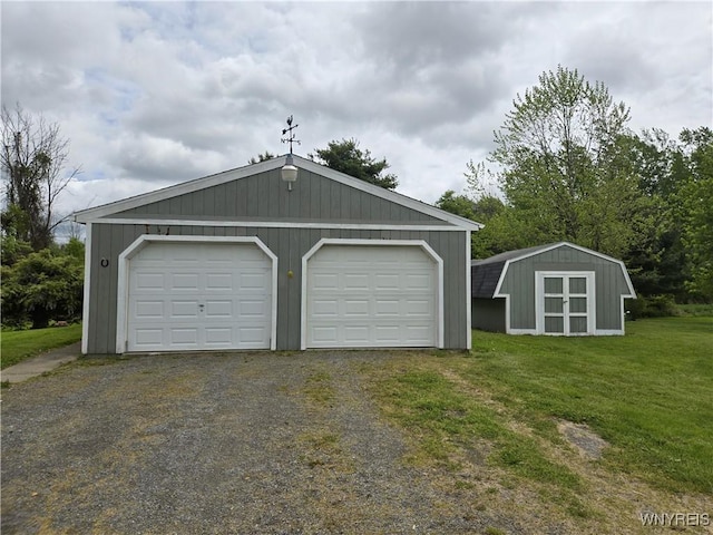 4003 Wood Rd, Albion, NY 14411 - detached garage with a storage unit and gravel driveway