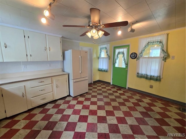4003 Wood Rd, Albion, NY 14411 - kitchen with freestanding refrigerator, rail lighting, light floors, white cabinets, and light countertops