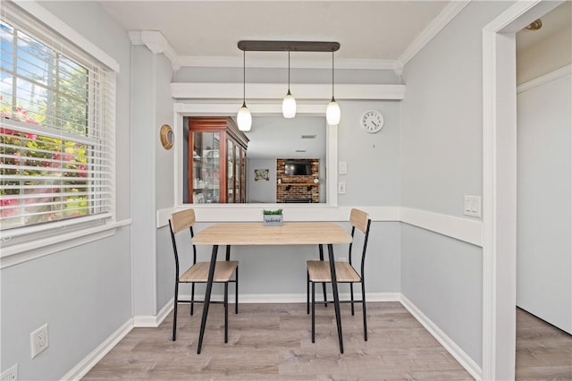 1 Briar Way, Perinton, NY 14450 - dining area featuring wood finished floors, crown molding, and baseboards