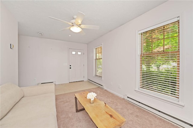 1 Briar Way, Perinton, NY 14450 - unfurnished living room featuring a baseboard heating unit, light colored carpet, and a ceiling fan