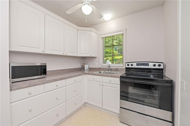 1 Briar Way, Perinton, NY 14450 - kitchen featuring appliances with stainless steel finishes, a sink, white cabinetry, and a ceiling fan