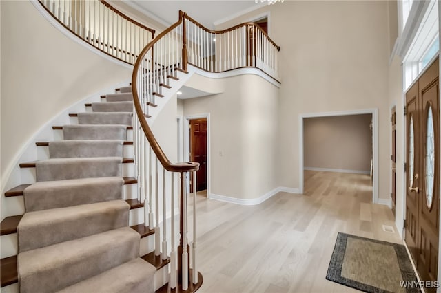 25 Davinci Ct, Amherst, NY 14221 - entryway with a high ceiling, stairs, wood finished floors, and baseboards