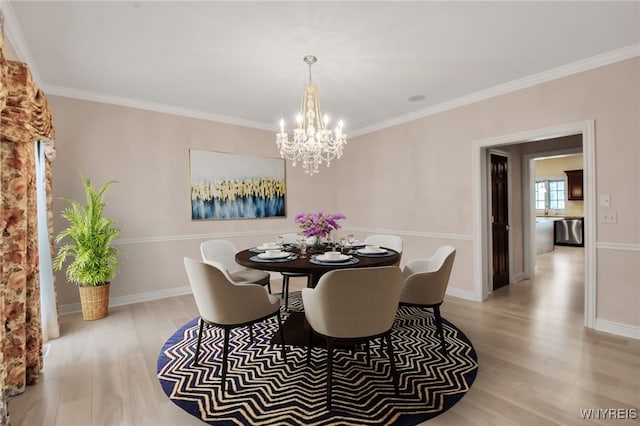 25 Davinci Ct, Amherst, NY 14221 - dining space with a chandelier, light wood finished floors, crown molding, and baseboards