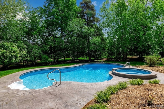 25 Davinci Ct, Amherst, NY 14221 - view of swimming pool with a pool with connected hot tub and view of scattered trees