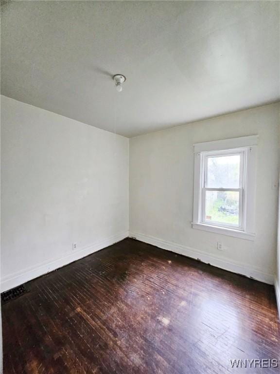 157 Victoria Ave, Buffalo, NY 14214 - spare room featuring dark wood-style flooring and baseboards