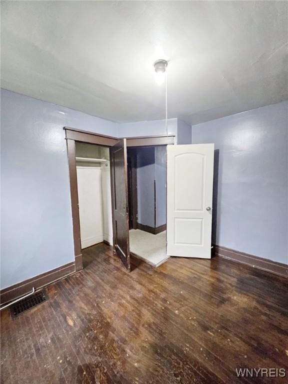 157 Victoria Ave, Buffalo, NY 14214 - unfurnished bedroom with baseboards, hardwood / wood-style floors, and a closet