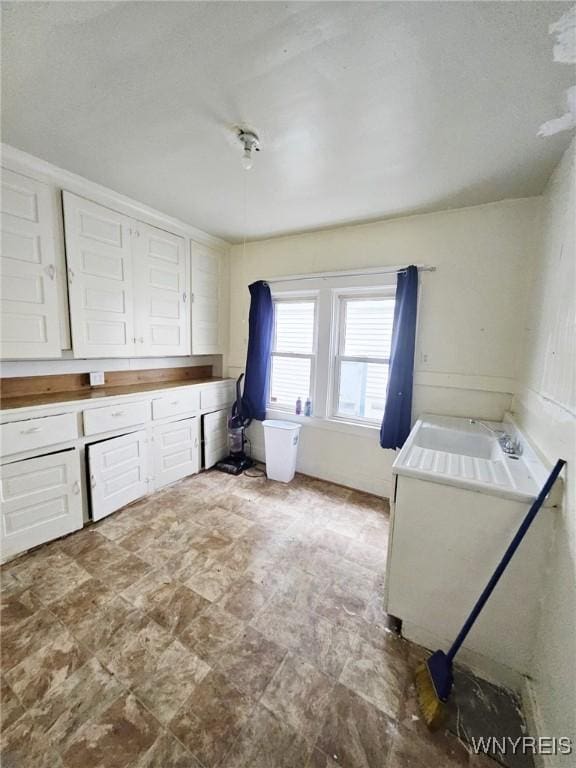 157 Victoria Ave, Buffalo, NY 14214 - washroom with stone finish flooring and a sink