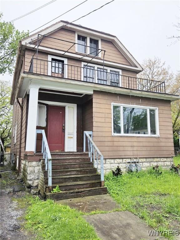157 Victoria Ave, Buffalo, NY 14214 - american foursquare style home featuring a balcony and entry steps