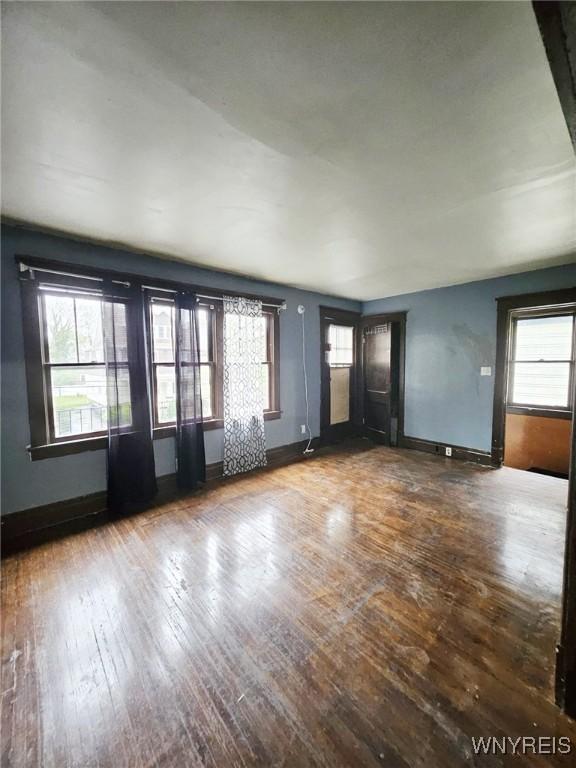 157 Victoria Ave, Buffalo, NY 14214 - unfurnished living room featuring hardwood / wood-style floors and baseboards