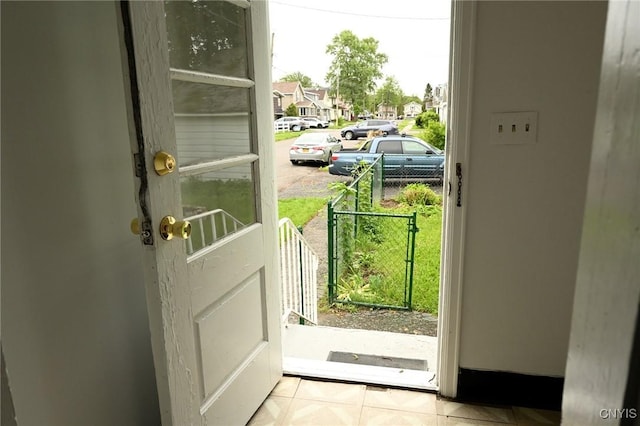801 Ballantyne Rd, Syracuse, NY 13207 - doorway with a residential view and tile patterned flooring