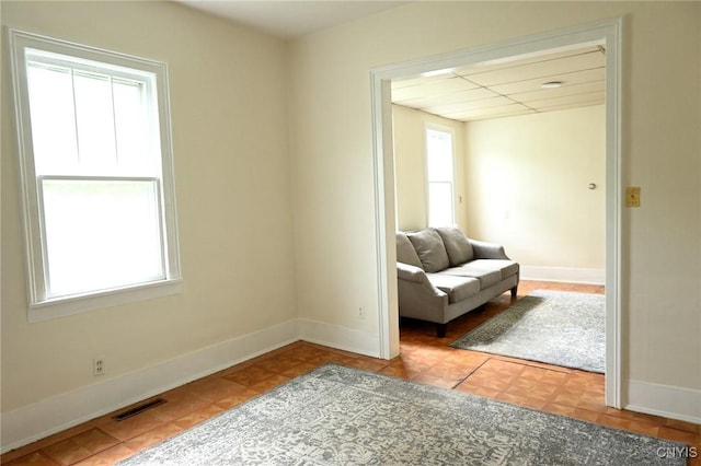801 Ballantyne Rd, Syracuse, NY 13207 - sitting room with healthy amount of natural light and baseboards