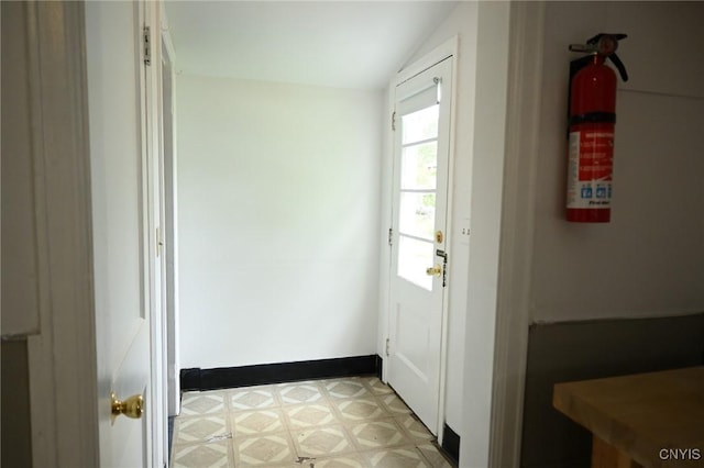 801 Ballantyne Rd, Syracuse, NY 13207 - doorway to outside with light flooring and vaulted ceiling