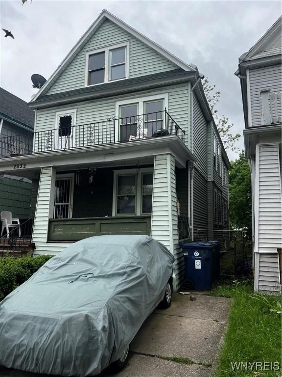2032 Fillmore Ave, Buffalo, NY 14214 - traditional style home featuring a balcony and covered porch