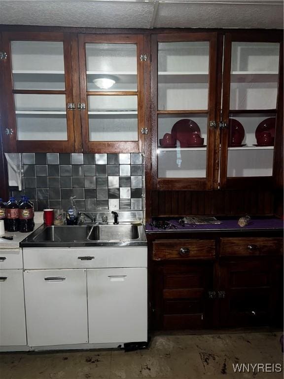 2032 Fillmore Ave, Buffalo, NY 14214 - kitchen with a sink, white cabinetry, and tasteful backsplash