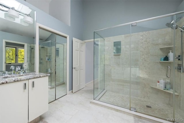 54 Contessa Ct, Amherst, NY 14221 - full bath with vanity, a shower stall, and marble finish flooring