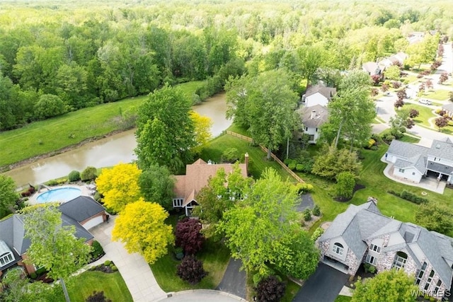54 Contessa Ct, Amherst, NY 14221 - drone / aerial view of a heavily wooded area, a large body of water, and a pool area