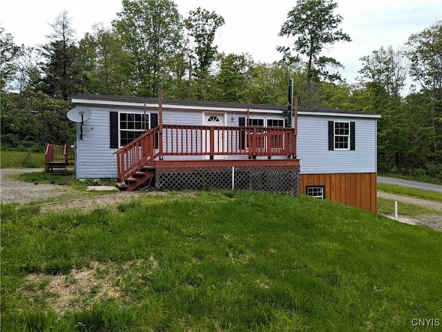 3377 Beeman Hollow Rd, Erwin, NY 14801 - back of property with a wooden deck, a lawn, and view of wooded area