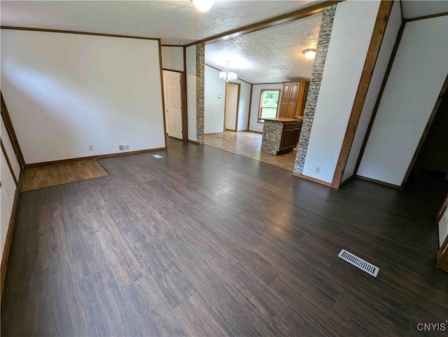 3377 Beeman Hollow Rd, Erwin, NY 14801 - unfurnished living room with dark wood finished floors, baseboards, a chandelier, and lofted ceiling