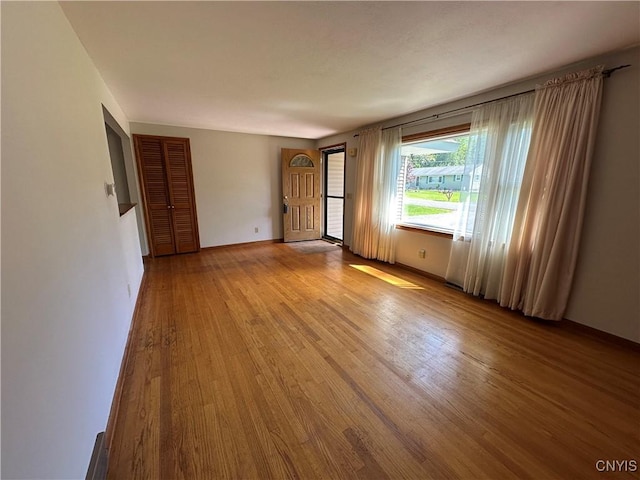 9385 Wickham Dr, Cicero, NY 13029 - empty room with wood finished floors