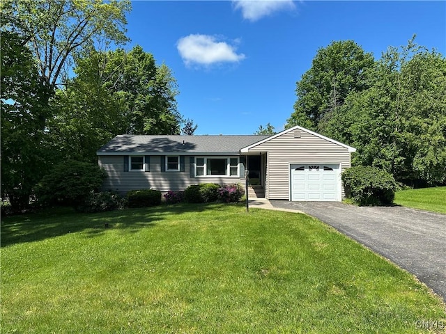 9385 Wickham Dr, Cicero, NY 13029 - single story home with an attached garage, driveway, and a front lawn
