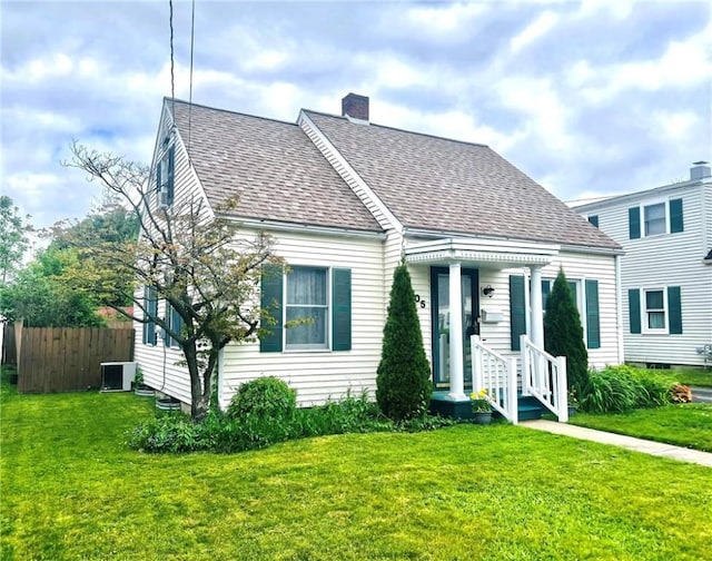 305 S Hoffman St, Elmira-City, NY 14904 - view of front facade featuring central AC, a shingled roof, and a chimney