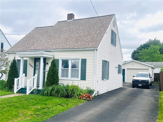 305 S Hoffman St, Elmira-City, NY 14904 - cape cod home featuring an outdoor structure, a detached garage, roof with shingles, a chimney, and asphalt driveway