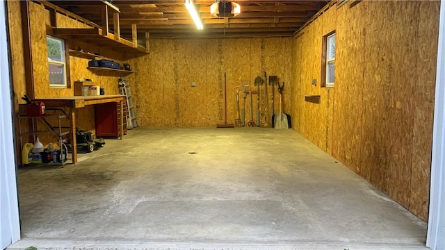 305 S Hoffman St, Elmira-City, NY 14904 - basement with a garage, a workshop area, and healthy amount of natural light