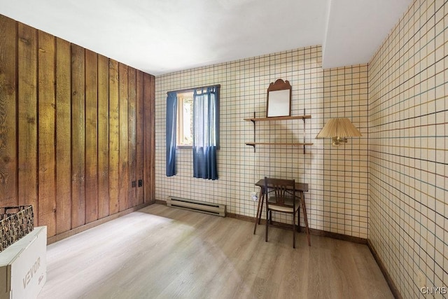 4962 Tall Oaks Dr, Manlius, NY 13066 - unfurnished room featuring a baseboard radiator and wood finished floors