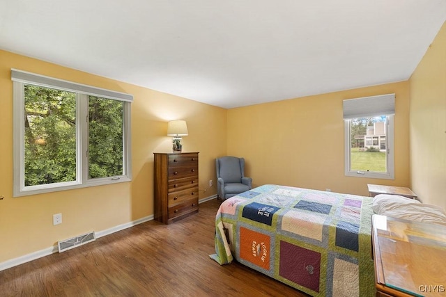 4962 Tall Oaks Dr, Manlius, NY 13066 - bedroom featuring multiple windows and wood finished floors