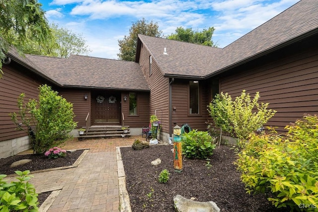 4962 Tall Oaks Dr, Manlius, NY 13066 - view of exterior entry featuring a shingled roof