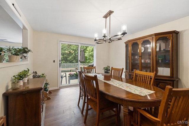 4962 Tall Oaks Dr, Manlius, NY 13066 - dining area featuring a chandelier and dark wood-type flooring