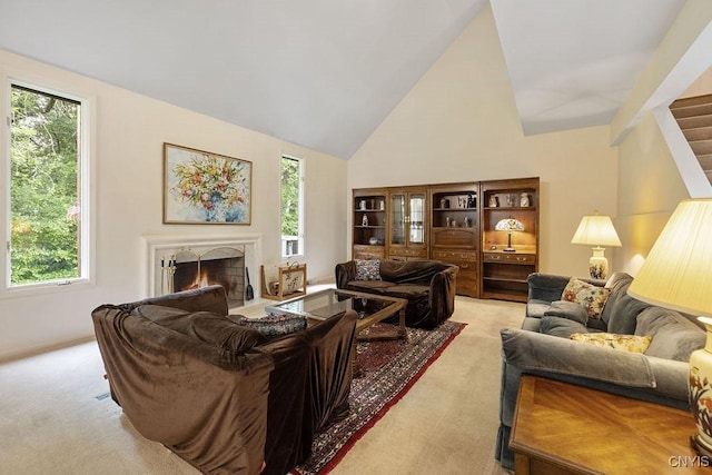 4962 Tall Oaks Dr, Manlius, NY 13066 - living room featuring carpet, healthy amount of natural light, a warm lit fireplace, high vaulted ceiling, and stairway