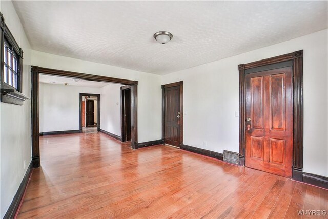 421 E Utica St, Buffalo, NY 14208 - unfurnished room with light wood finished floors and baseboards