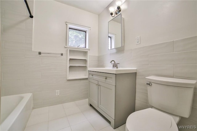 421 E Utica St, Buffalo, NY 14208 - full bathroom featuring tile walls, vanity, toilet, and tile patterned floors