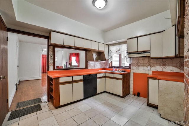421 E Utica St, Buffalo, NY 14208 - kitchen featuring black dishwasher, white cabinets, backsplash, and light tile patterned flooring