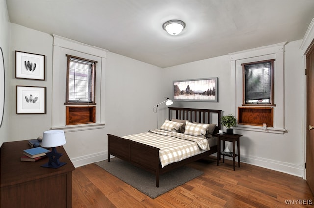 421 E Utica St, Buffalo, NY 14208 - bedroom with baseboards and wood finished floors