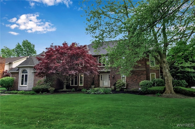 8395 Black Walnut Dr, Clarence, NY 14051 - view of front of home with brick siding and a front lawn