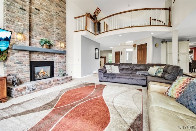 8395 Black Walnut Dr, Clarence, NY 14051 - carpeted living area with a high ceiling, a fireplace, and baseboards