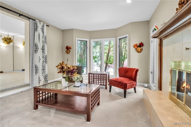 8395 Black Walnut Dr, Clarence, NY 14051 - living room with light carpet, a fireplace, baseboards, and recessed lighting