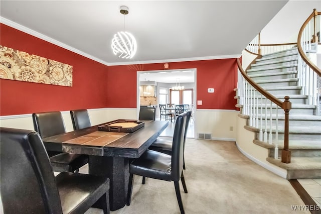 8395 Black Walnut Dr, Clarence, NY 14051 - carpeted dining space with a chandelier, stairway, and ornamental molding